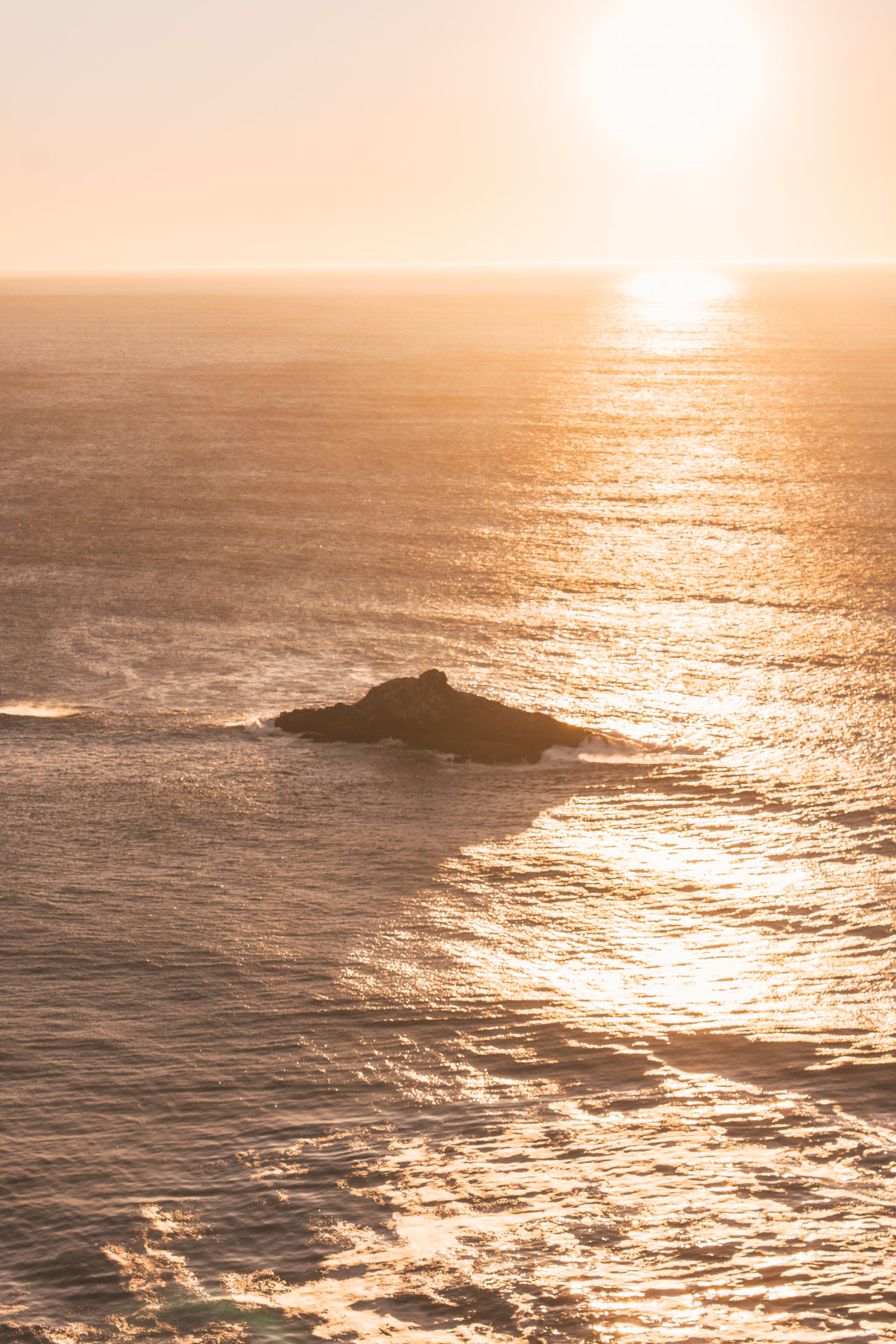 Golden sunlight across ocean waves