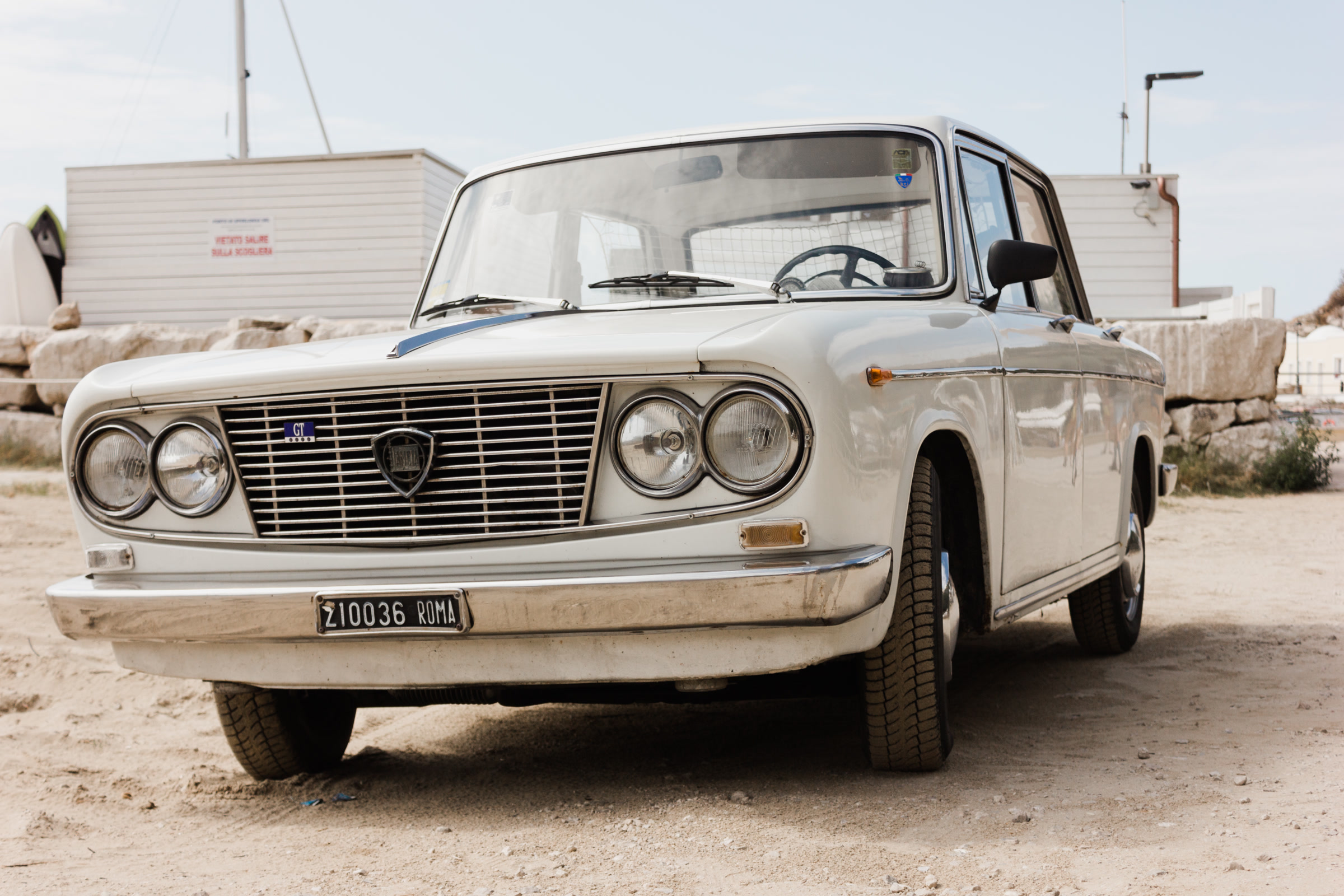 Vintage white car in bright sun
